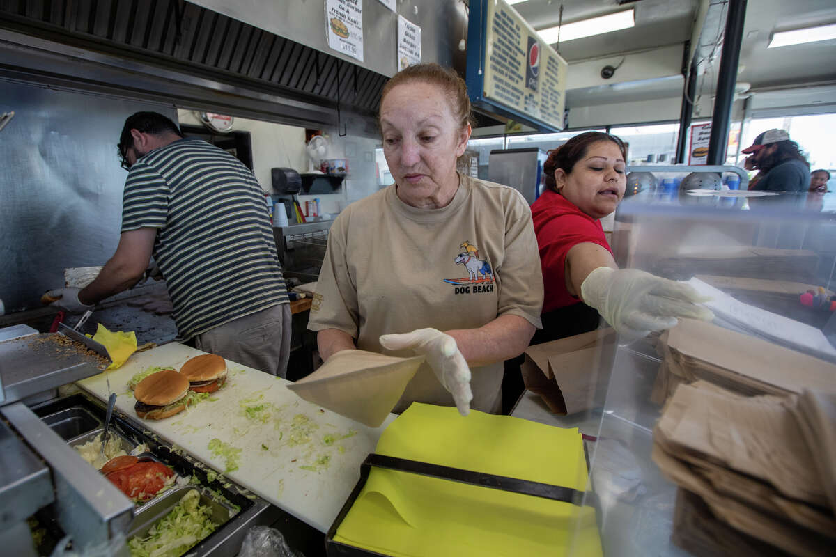 Owner Jennifer Gladstone prepares an order at Bud's Giant Burgers in Vallejo, Calif., on May 24, 2023.