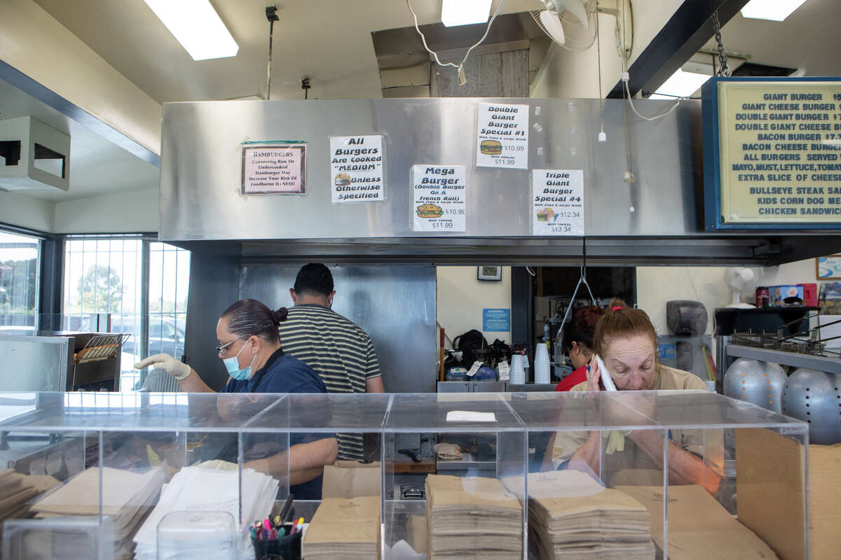 Staff work behind the counter at Bud's Giant Burgers in Vallejo, Calif. on May 24, 2023.