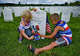 Article image Myra Bear and her brother Ellison visit the gravesite of U.S. Navy Capt. James Higdon on Memorial Day.