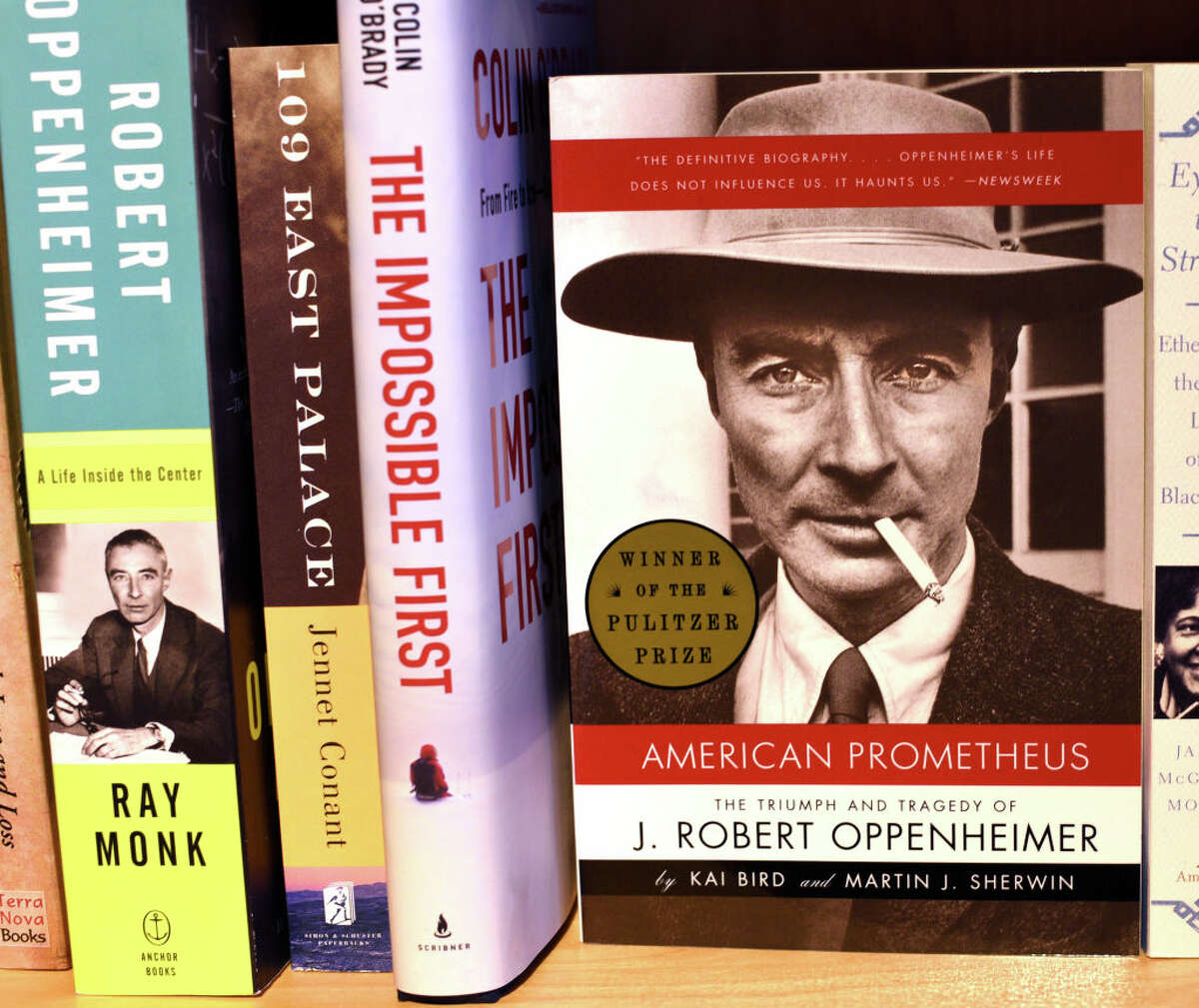 Books on J. Robert Oppenheimer and the development of the atomic bomb, including the biography "American Prometheus" are among those on a bookstore shelf in Santa Fe, New Mexico. The 2023 movie "Oppenheimer" was based on "American Prometheus."