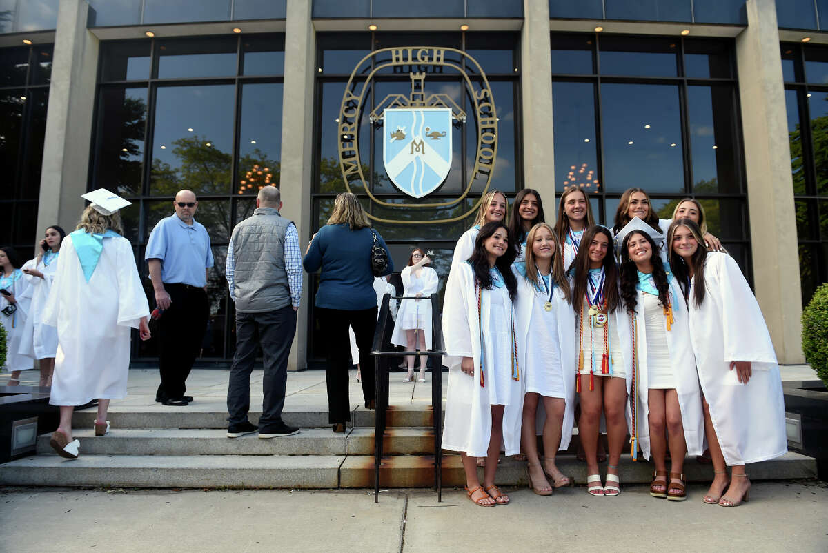 Mercy high graduates 84 in Middletown CT helping the 'world bloom'