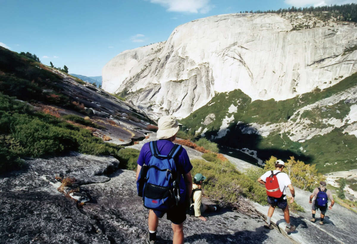 Hikers descend into Tenaya Canyon in California's Yosemite National Park.