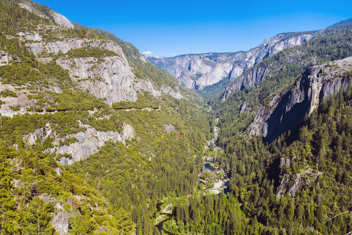 The Merced River flows down in the canyon at Yosemite National Park in California.