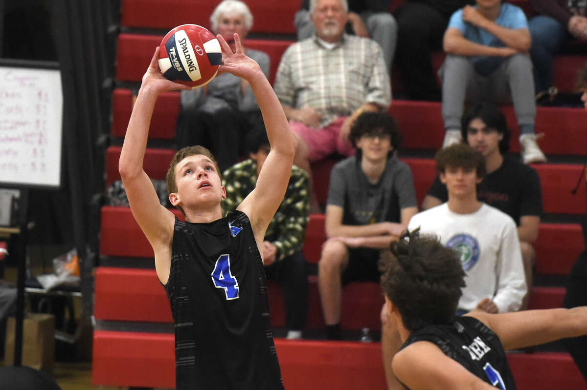 Darien's Griffith Crouse (5) sets the ball against Trumbull during the FCIAC boys volleyball final at Fairfield Warde on Friday, May 26, 2023.