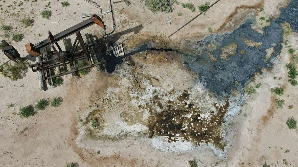 An abandoned well leaks oil and produced water onto the surface of Schuyler Wight's ranch on Wednesday, April 26, 2023 in West Texas.