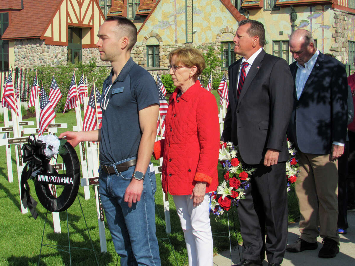 Local elected officials stand in line to lay wreaths during a ceremony on Memorial Day, May 29, 2023 at the Midland County Veterans Memorial. From left: State Rep. Bill G. Schuette, Midland Mayor Maureen Donker, Midland County Commissioner Eric Dorrien and U.S. Rep. Dan Kildee.