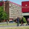 Immigrants from Venezuela walk from the Ramada Plaza by Wyndham Albany hotel on Monday, May 29, 2023 in Albany N.Y. 40 migrants are being housed at the hotel after being bused to Albany on Sunday night.