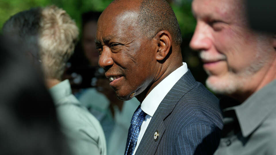 Houston Mayor Sylvester Turner watches baby Okapi Sylvester, named after him, making his public debut Tuesday, May 30, 2023, at Houston Zoo in Houston. Baby Sylvester was born to mom Sukari on April 20 at around 40 pounds. He weights around 90 pounds now, and will be meeting the public every morning from today.