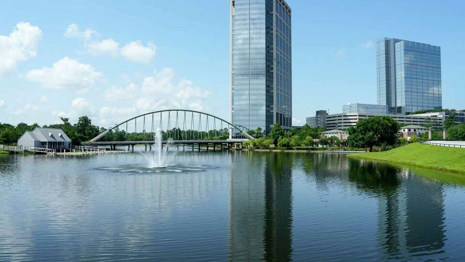 The Woodlands Towers are shown in front of a lake on Tuesday, May 30, 2023 in The Woodlands. Occidental Petroleum is the main tenant in the left tower.