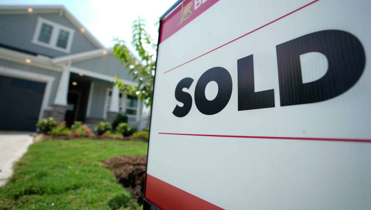 A sold sign is shown outside a home in the master-planned community of Towne Lake Tuesday, May 30, 2023, in Cypress.