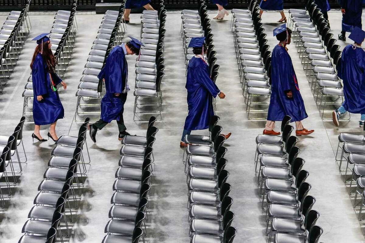 Students of Carnegie Vanguard High School graduate on Tuesday, May 30, 2023 in Houston. The magnet campus has never had a student graduate through a committee override.