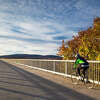 A cyclist on the Walkway Over the Hudson, part of the Empire State Trail and on the route of the inaugural Cycle the Hudson Valley ride from Troy to New York City.