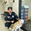 Officer M. Ramirez from the Laredo Police Department is pictured with Strawberry, a 4-year-old dog up for adoption through Laredo Animal Care Services.