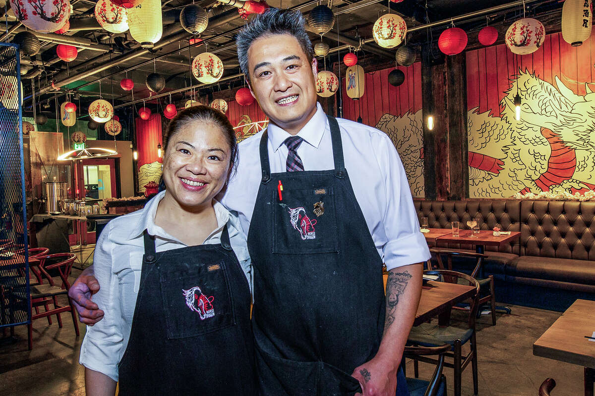 Dragon Horse co-owners Vicky Lin, left, and Derrick Li work together at their SoMa bar and restaurant in San Francisco on May 20, 2023.