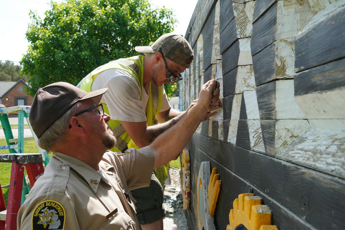 to Bad Axe signs touched up after months of planning