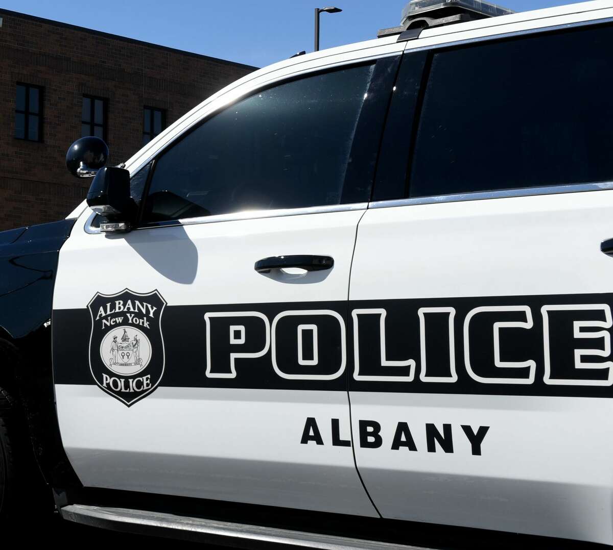 Albany police said they charged a driver June 2 after a woman was seen on his hood as he drove at a high speed.   