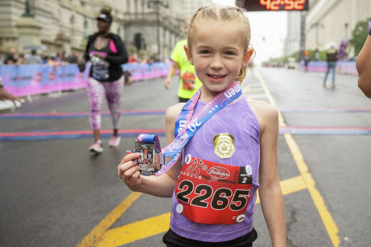 Six-year-old Isabella Smith shows off her medal after finishing the 45th Freihofer’s Run for Women on Saturday, June 3, 2023, in Albany, NY.