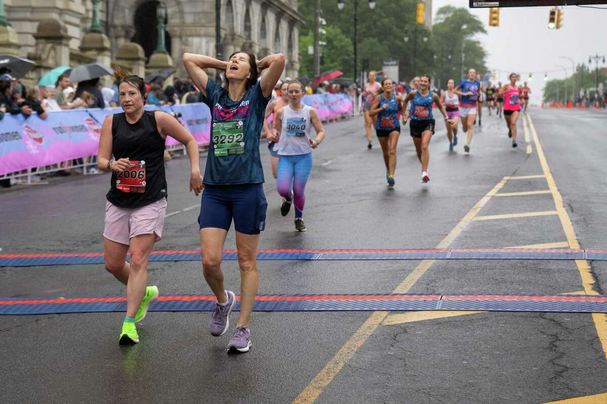 Rachael Austin, left, and Jennifer Morrell finish the 45th Freihofer’s Run for Women on Saturday, June 3, 2023, in Albany, NY.