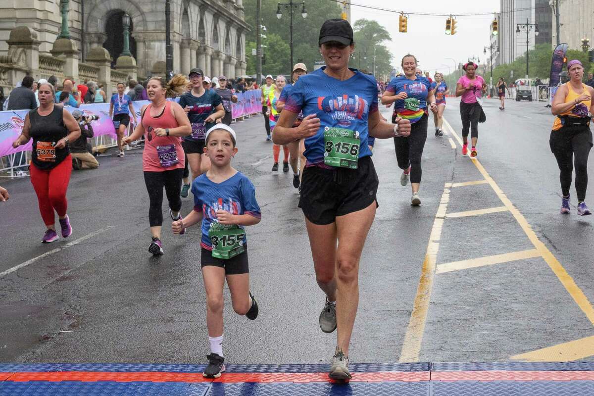 Josslyn Ford, left, and Nicole Ford finish the 45th Freihofer’s Run for Women on Saturday, June 3, 2023, in Albany, NY.