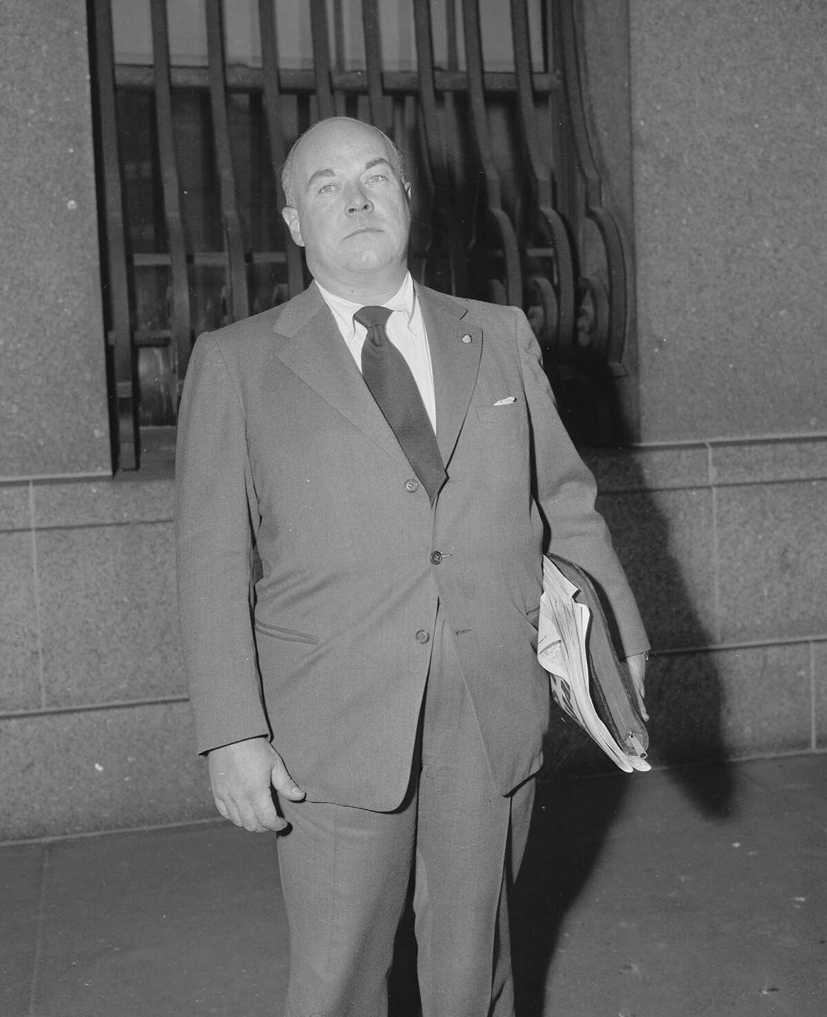 FILE: An undated photo shows George Hunter White, supervisor for the New England area of the Federal Narcotics Bureau, as he enters federal court to go before a grand jury.