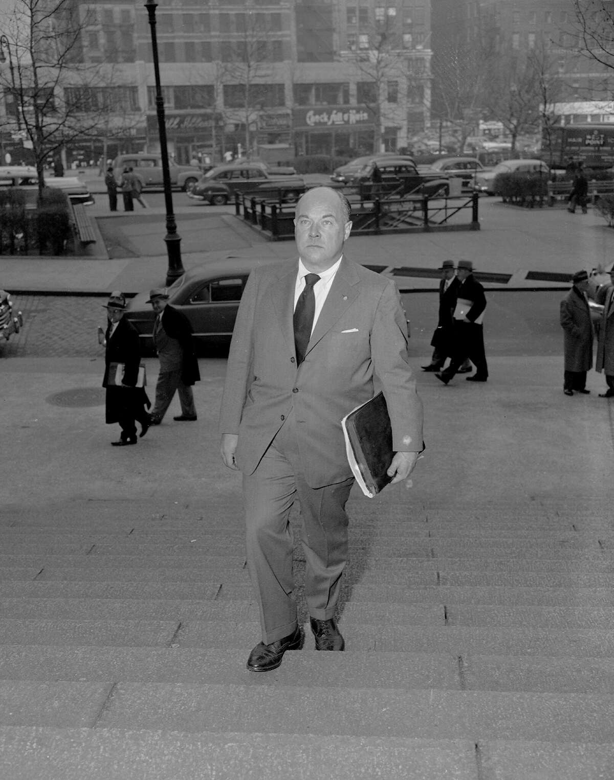 FILE: An undated photo shows George Hunter White, supervisor for the New England area of the Federal Bureau of Narcotics, as he enters federal court to go before a grand jury.