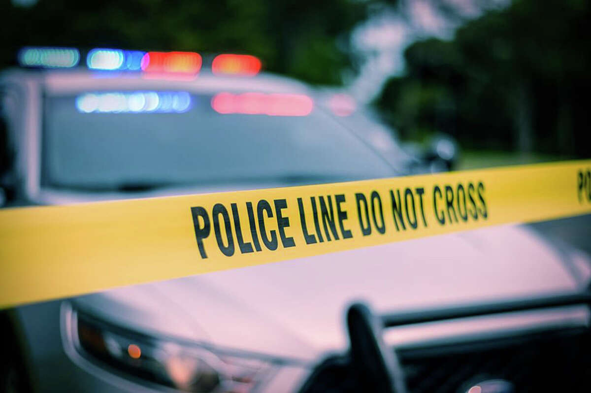A file photo of a police cruiser and yellow police tape. Connecticut State Police said a truck was carrying about 2,200 gallons of fuel oil when its driver was arrested and charged with operating a commercial vehicle under the influence.