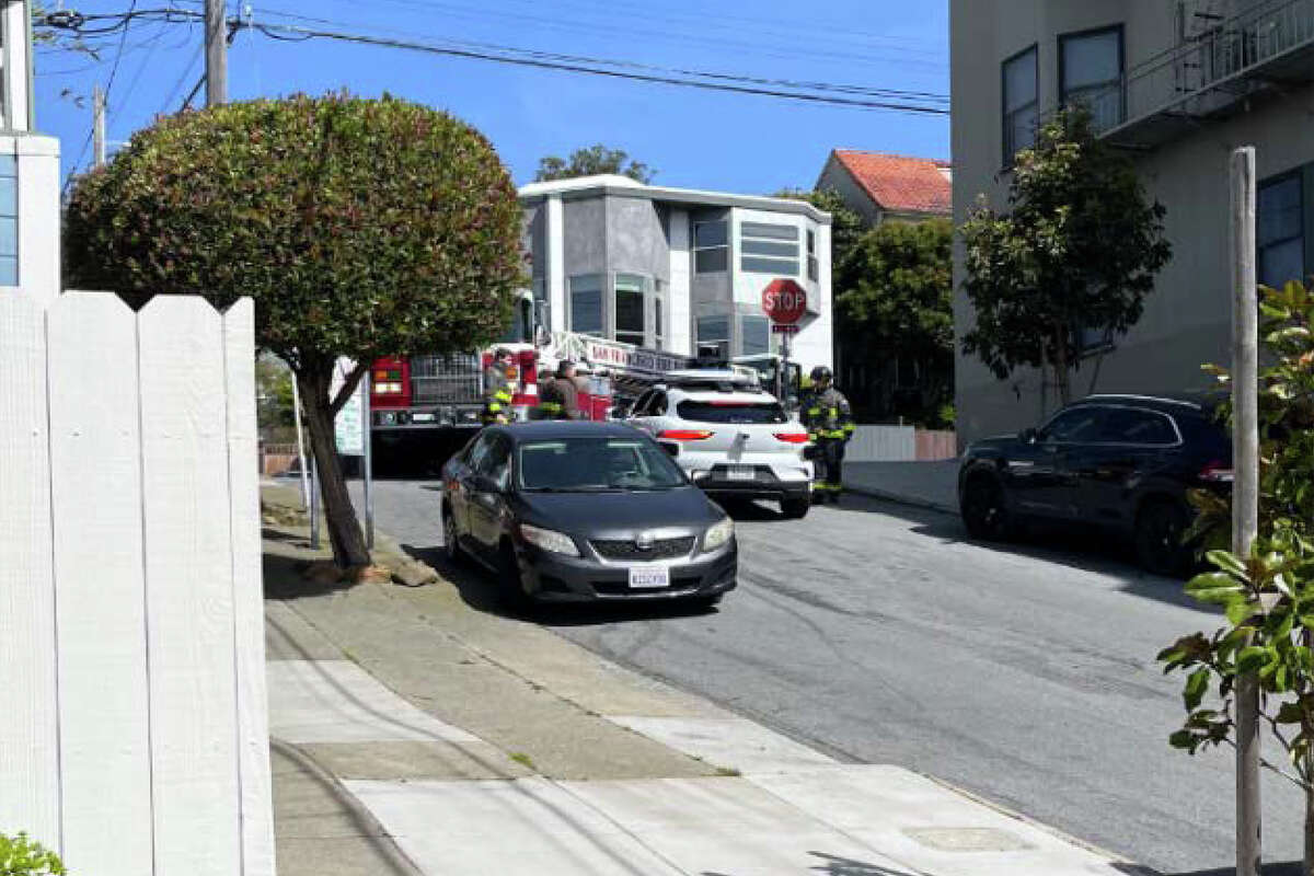 A Waymo vehicle stops in front of fire truck in San Francisco, Calif.