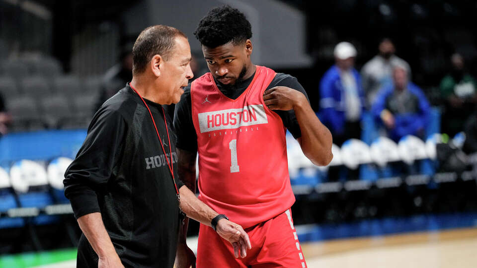 Houston head coach Kelvin Sampson, left, talks to guard Jamal Shead (1) during a practice ahead of the first round of the NCAA Men's Basketball Tournament on Wednesday, March 15, 2023, in Birmingham, Ala. Top-seeded Houston play No. 16 Northern Kentucky in a first-round game to open the tournament.