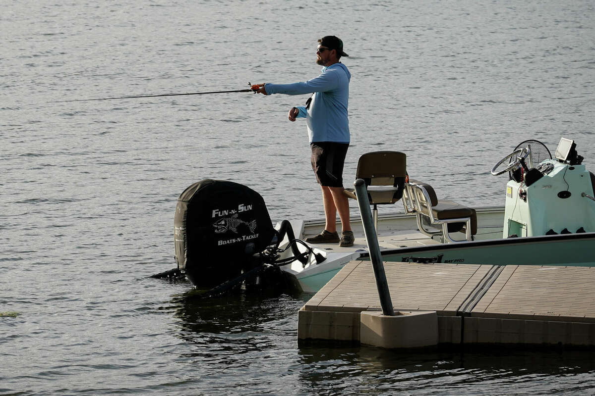 Justin Prisock, a fishing guide, casts his line as he waits for his friend to bring the truck to the boat ramp Wednesday March 22, 2023, at Fairfield Lake State Park in Fairfield.