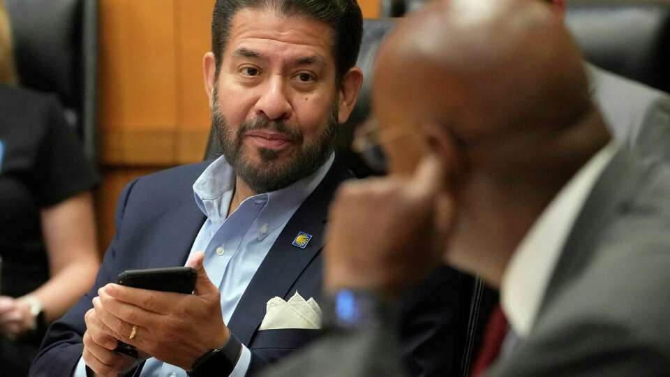 Adrian Garcia, Commissioner Precinct 2, left, and Rodney Ellis, Commissioner Precinct 1, right, are shown during Commissioners Court, 1001 Preston St., Tuesday, June 6, 2023, in Houston.