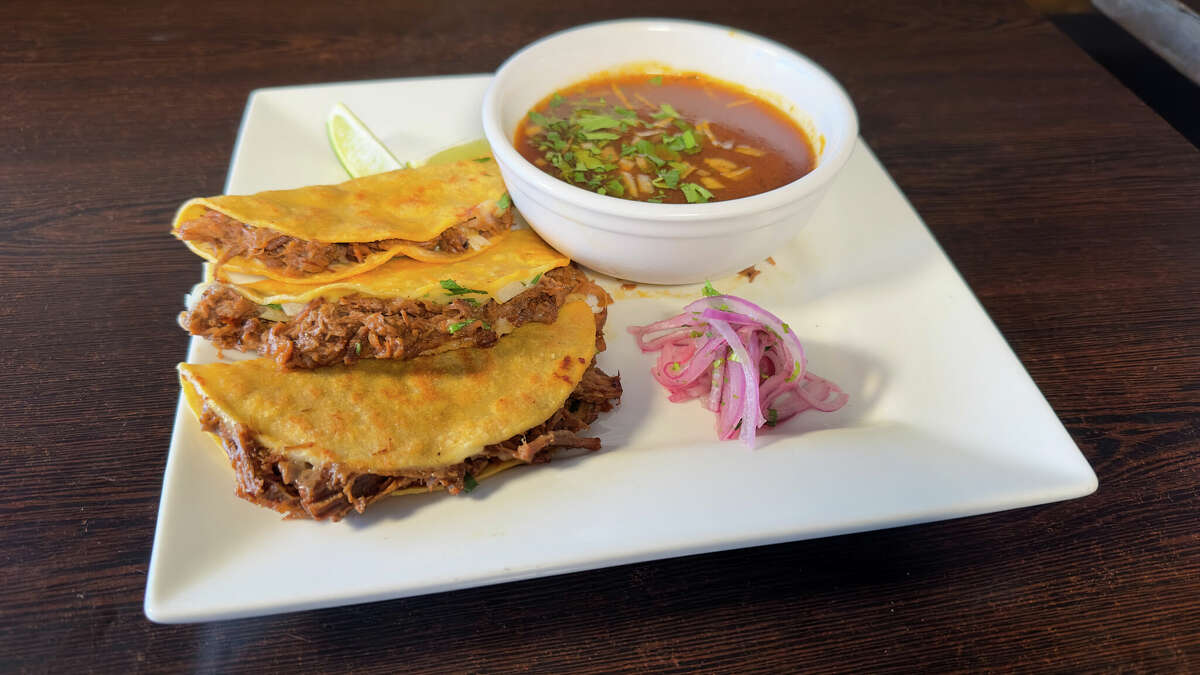 Americana's birrita tacos are served with a side of consommé, and other tacos are prepared with marinated chicken and steak and fried mahi-mahi. 