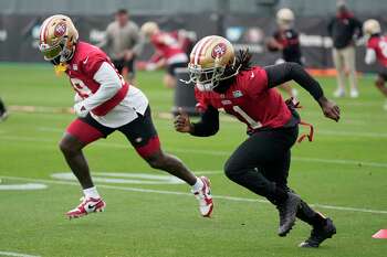 49ers wide receiver Brandon Aiyuk hurdles for touchdown, shows