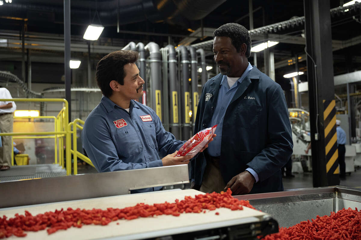 Jesse Garcia and Dennis Haysbert play Richard Montañez and Clarence C. Baker in “Flamin’ Hot.” 