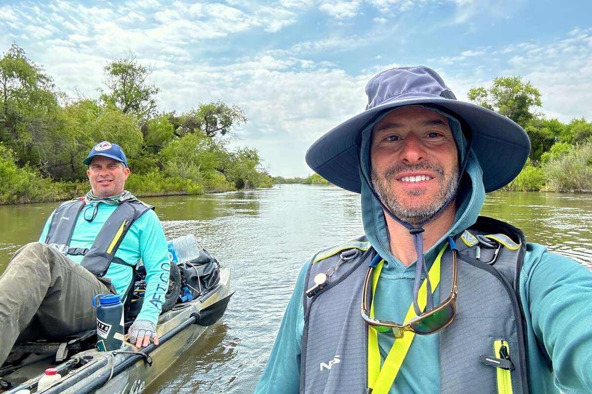 Kayaking journalists Brendan Borrell and Tom Fowlks paddle their boats from Tulare Lake toward San Francisco Bay.