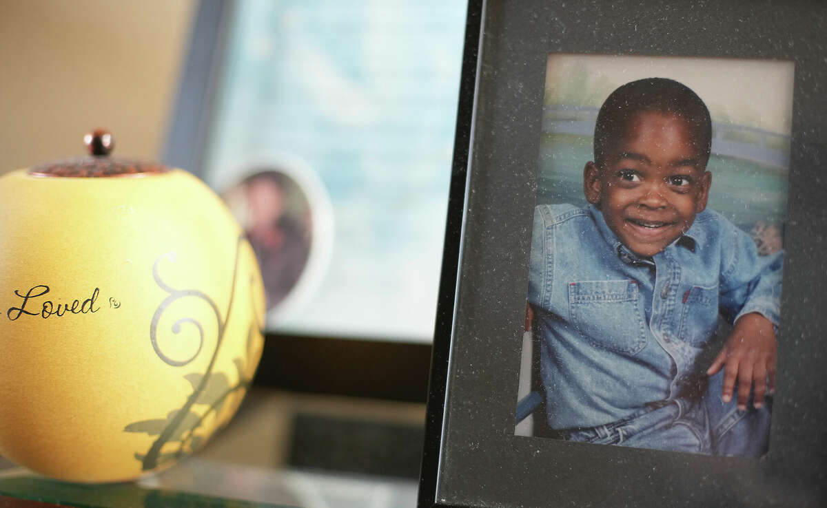 A photo of Jalen Randle when he was two years old sits in the entry way of his mother, Tiffany Rachal’s home on Monday, April 3, 2023 in Cypress. Randle was fatally shot by a Houston Police Officer last year after a chase.