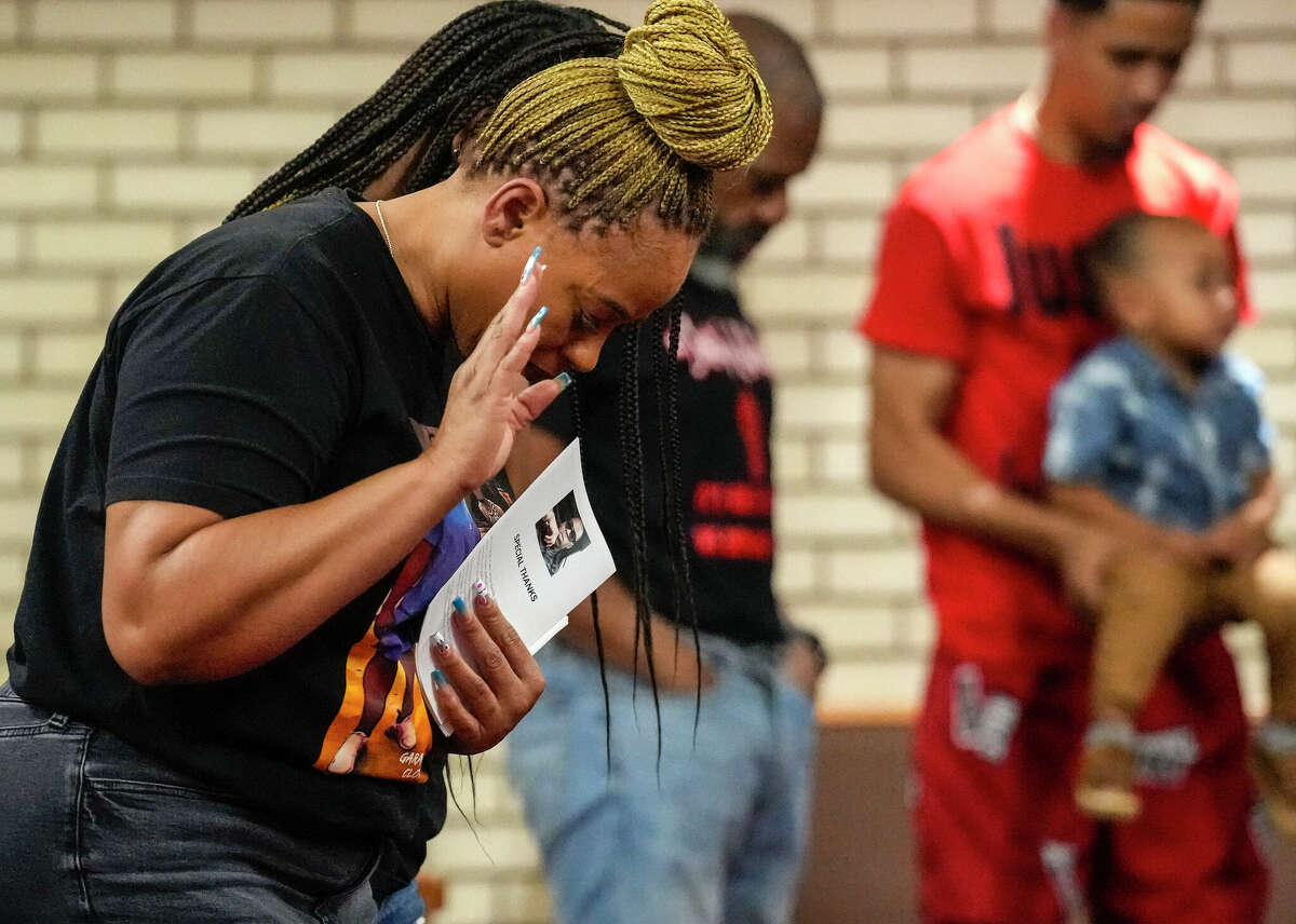 Tiffany Rachal prays during a memorial service her son, Jalen Randle at Fifth Ward Missionary Baptist Church on Friday, April 21, 2023 in Houston. Jalen Randle was was fatally shot by an HPD officer nearly a year ago.