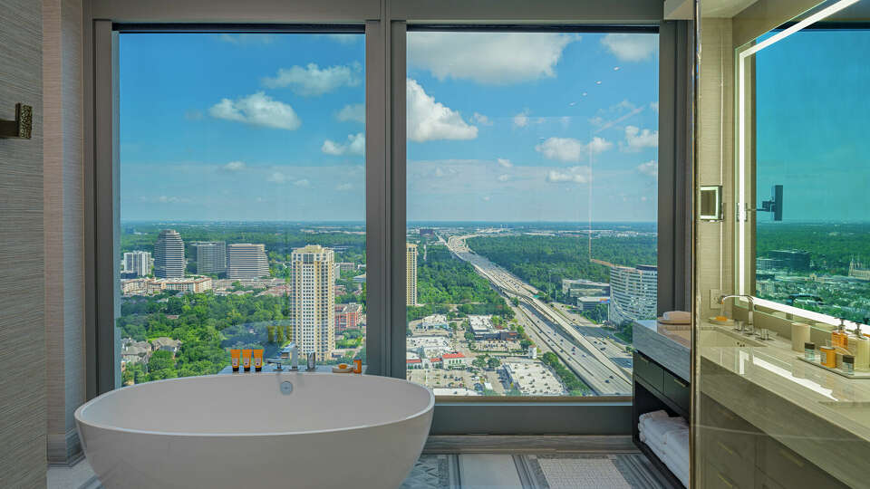 A bathroom on the east side of the 33rd floor, which is part of the 2-story Penthouse Suite at the Post Oak Hotel. 