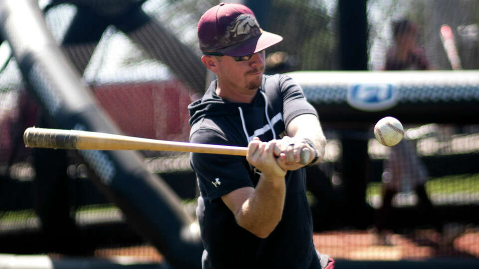 Magnolia West head coach Travis Earles hits ball during practice at Vista Ridge High School on Friday, June 9, 2023 in Cedar Park. Magnolia West will play Argyle in the Class 5A state championship on Saturday.