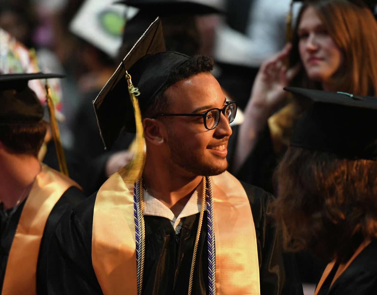 Graduating senior Joseph Colon smiles during the Class of 2023 Commencement Ceremony at Academy of Information Technology & Engineering (AITE) in Stamford, Conn. Tuesday, June 13, 2023.