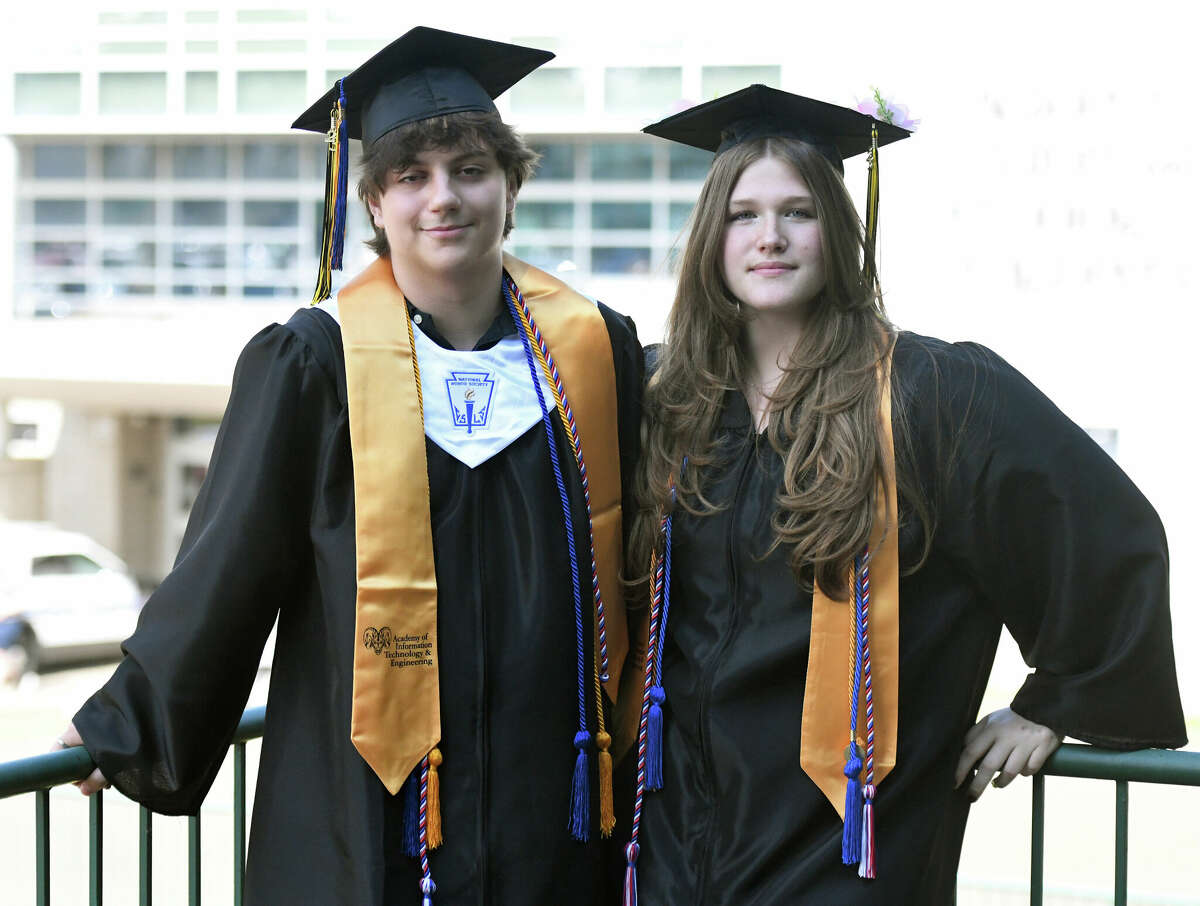 Graduating seniors Danyil Gera and Zofia Gibas, who are both concurrently completing Associate Degrees from Norwalk Community College, pose at the Class of 2023 Commencement Ceremony at Academy of Information Technology & Engineering (AITE) in Stamford, Conn. Tuesday, June 13, 2023.