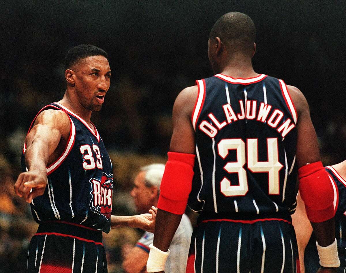 Scottie Pippen of the Houston Rockets (L) talks with teammate Hakeem Olajuwon during their game Feb. 5 against the Los Angeles Lakers in Los Angeles.