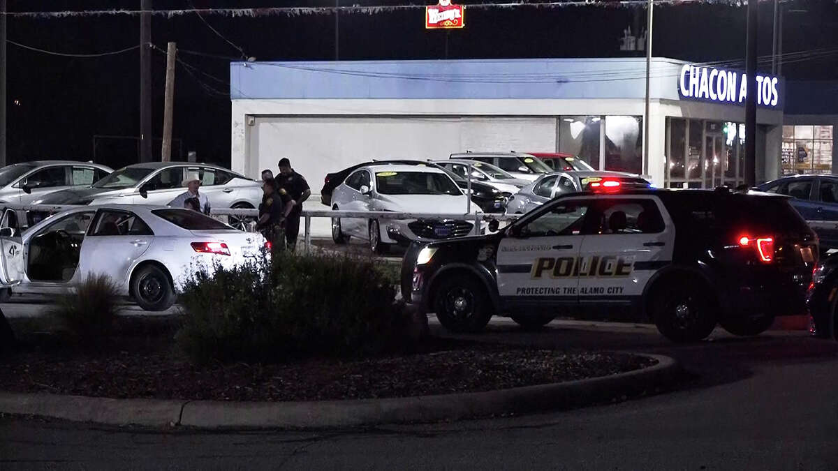 San Antonio police examine the scene of a shooting Saturday night in the 8300 block of Bandera Road. Darwin Gomez, 26, was arrested on a charge of aggravated assault with a deadly weapon in connection with the shooting.