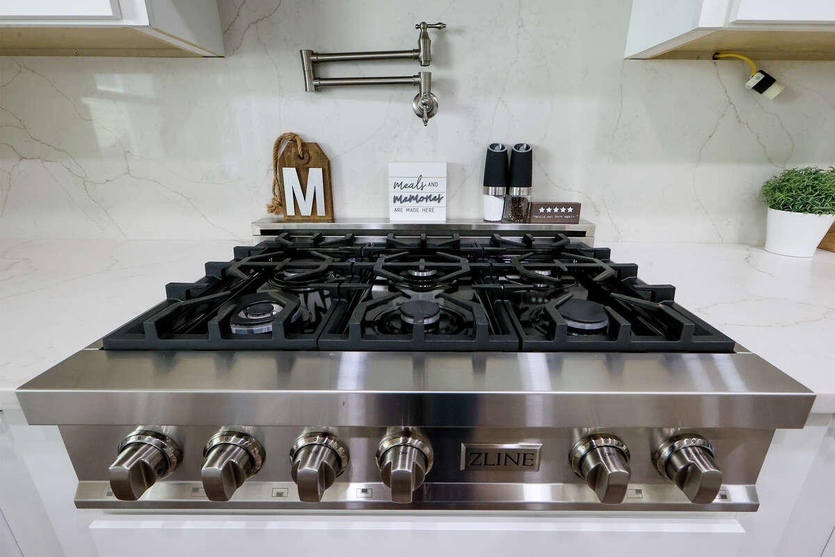 A pot filler above the new gas range is one of the many features added during a recent renovation of Michelle and Rick Morales' Helotes kitchen.
