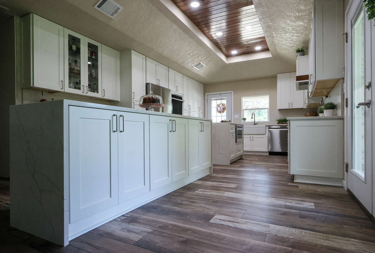 The two kitchen islands each has a different function. The longer one is closer to the living area and so is more for entertaining, setting out food and has space for four chairs where people can sit and eat. The second is nearer the stove and so is used for cooking and food prep.