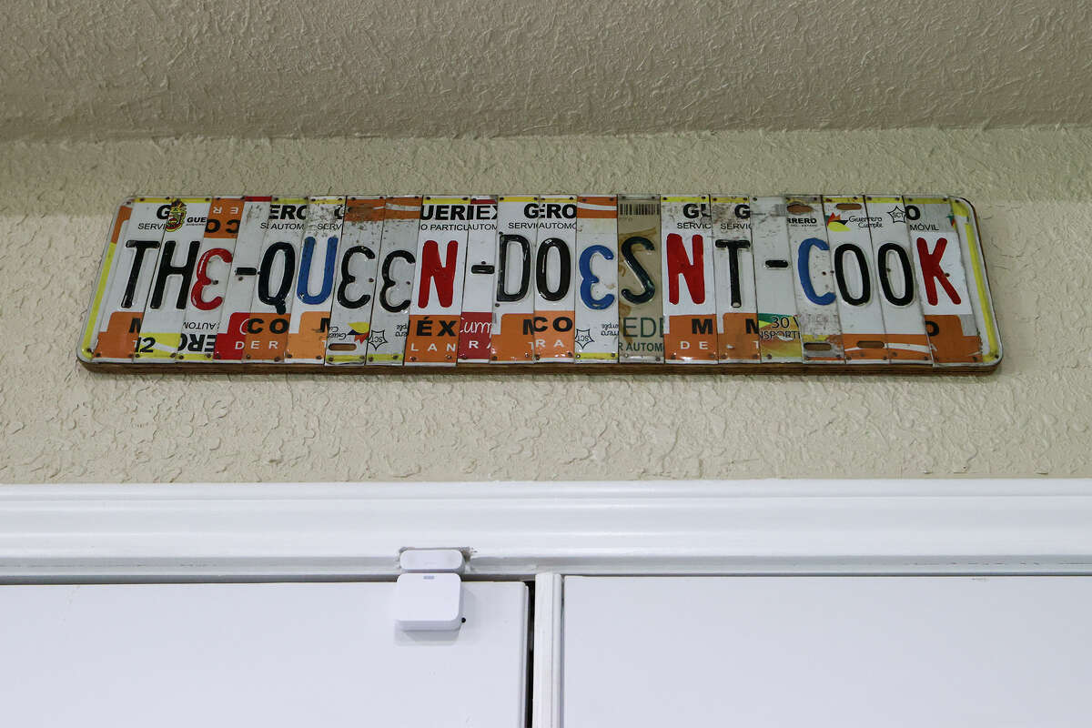 A sign made from license plates provides some personality in the kitchen.