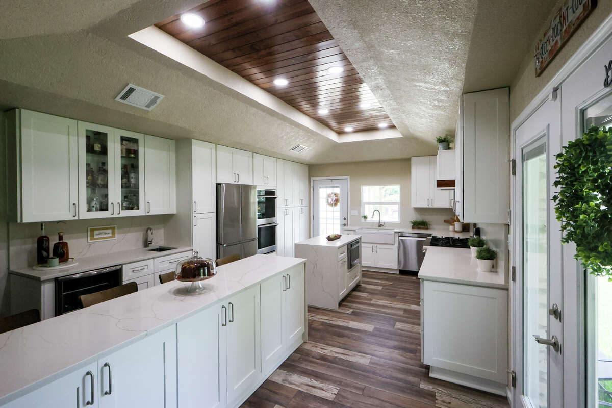 The new updated kitchen is large enough to can accommodate more than one cook at a time, which is a good thing because when the homeowners entertain, the whole family pitches in.