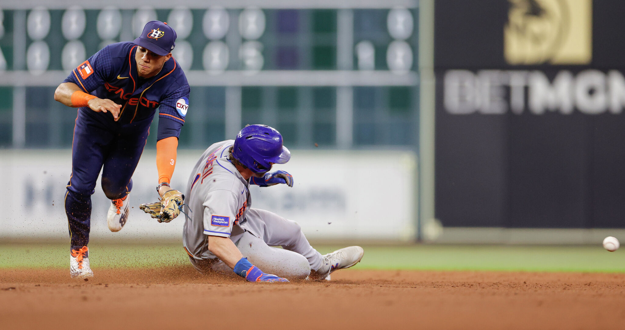 New York Mets' Pete Alonso (20) celebrates with third base coach Joey Cora  (56) after hitting a two-run home run against the Houston Astros during the  sixth inning of a baseball game