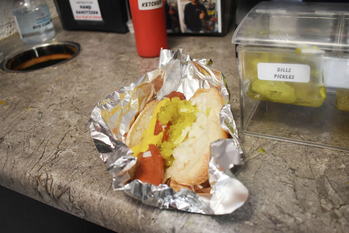 Preparing the perfect hot dog at Boat Launch Mini Mart in Santa Barbara, Calif. 