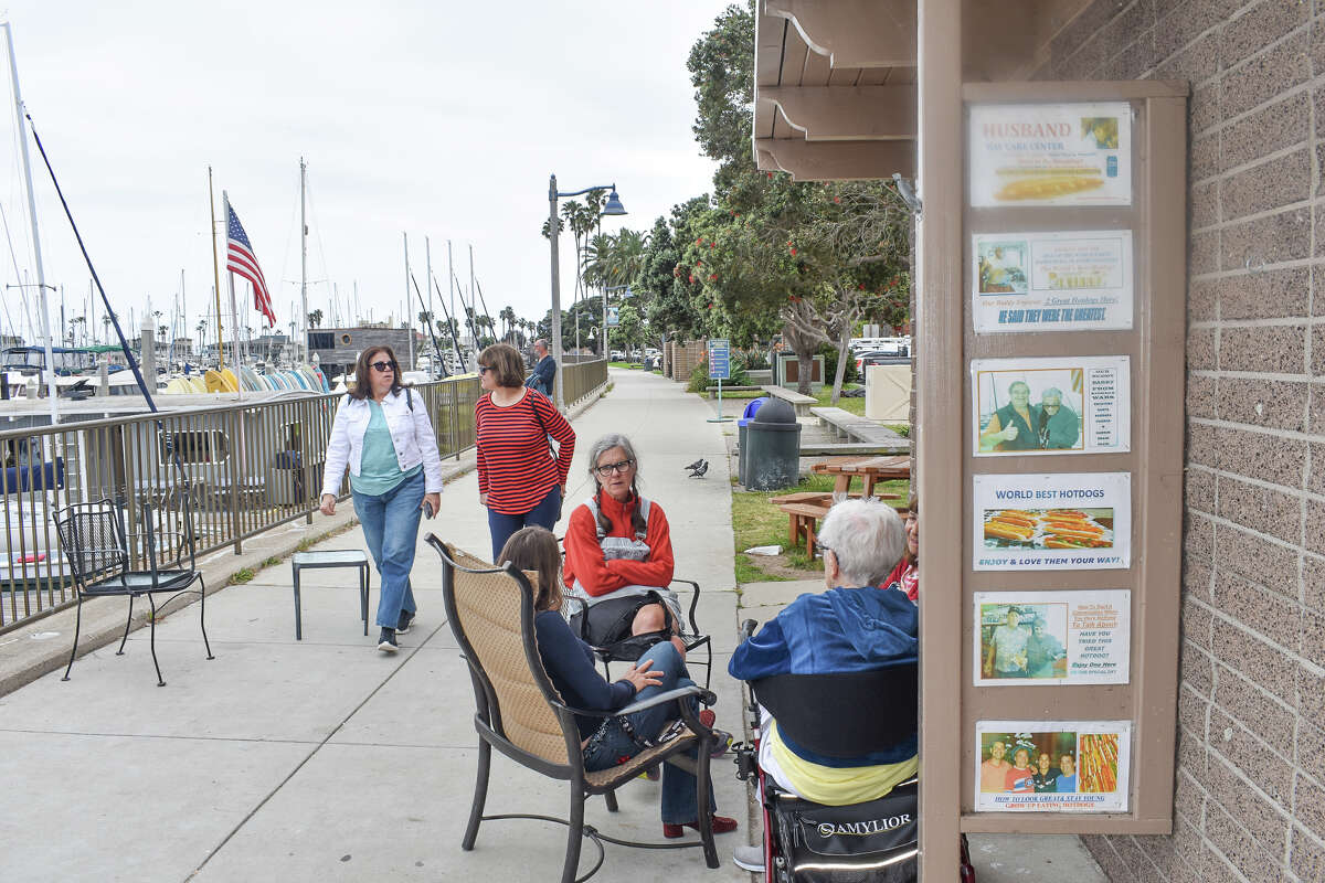 People sit outside of Harbor Snack Shack in Santa Barbara, Calif., on May 31, 2023. 