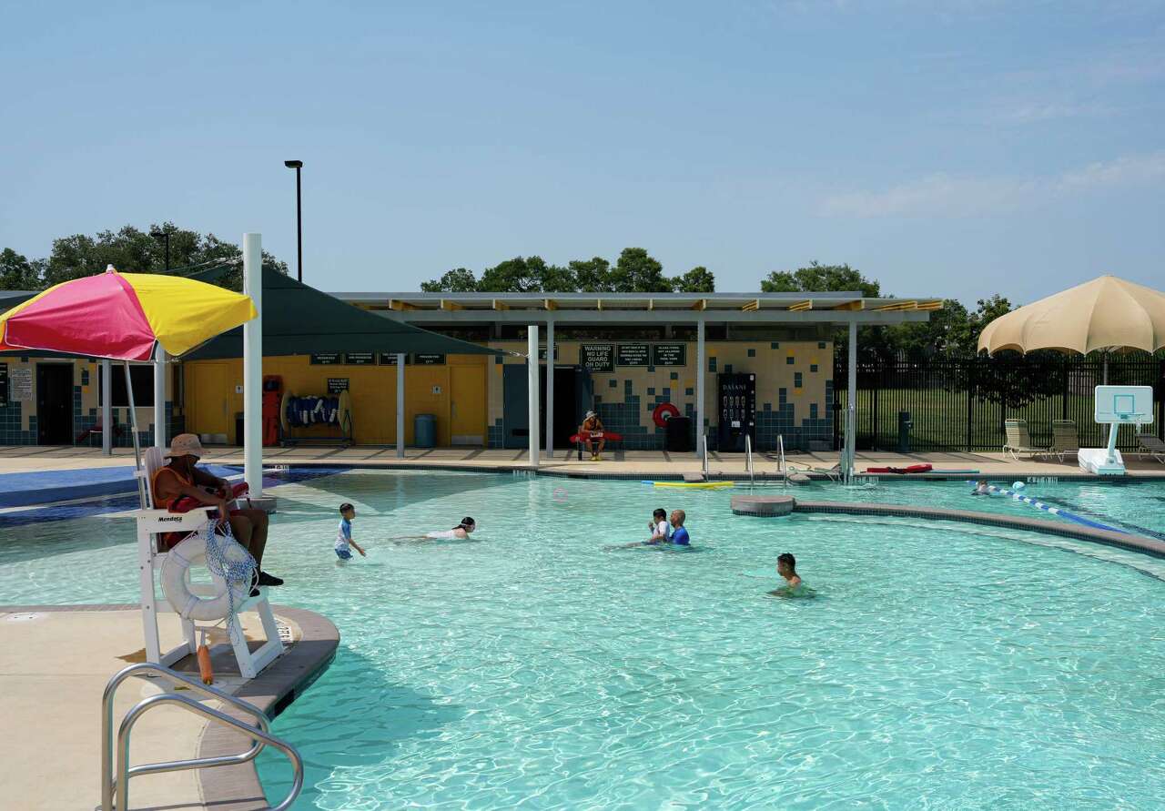 People enjoy their time in the water on Tuesday, June 20, 2023 at Sharpstown Park in Houston.